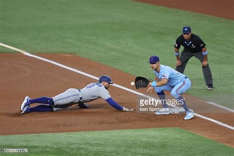 Texas Rangers First Base Nate Lowe Catches A Pick Off Throw In The