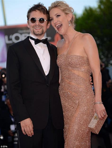 Kiss me Kate Hudson puckers up to fiancé Matt Bellamy in a shimmering