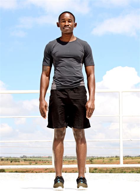 Young Athletic Black Man Standing Outside Ready To Exercise