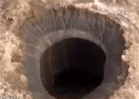 Giant Hole Appears In Siberia Huge Crater Emerges In The End Of The World Daily Mail Online