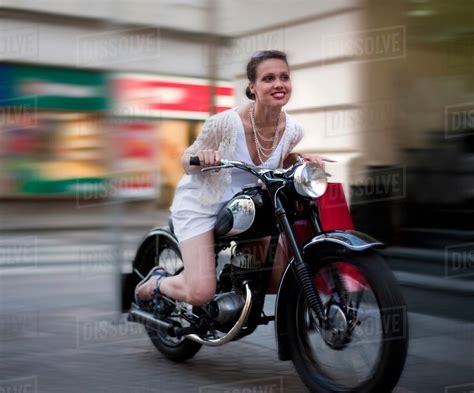 Young Woman Riding Motorcycle Stock Photo Dissolve