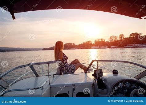 Sunbathing On A Sunset On Front Deck Of A Boat Royalty Free Stock