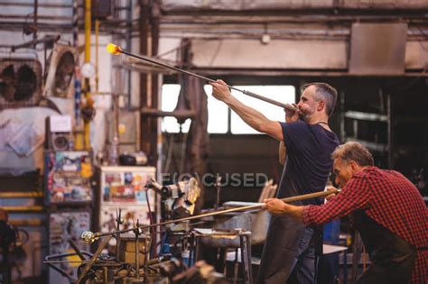 Glassblowers Shaping A Glass On The Blowpipe At Glassblowing Factory — Workshop Hand Tool