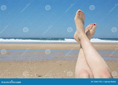 Beautiful Woman S Legs On The Beach Stock Photo Image Of Foot Lying