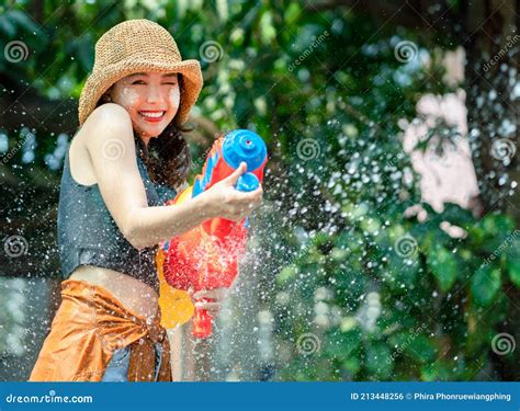 Smiling Asian Woman Was Splashed By Water She Is Using A Water Gun For Songkran Festival Stock