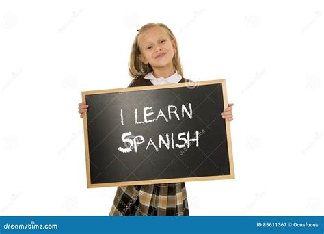 Schoolgirl Smiling Happy And Cheerful Holding And Showing Small Blackboard With Text I Learn