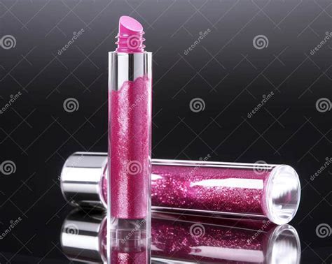A Hot Pink Magenta Lip Gloss With A Shimmering Shine That Reflects The