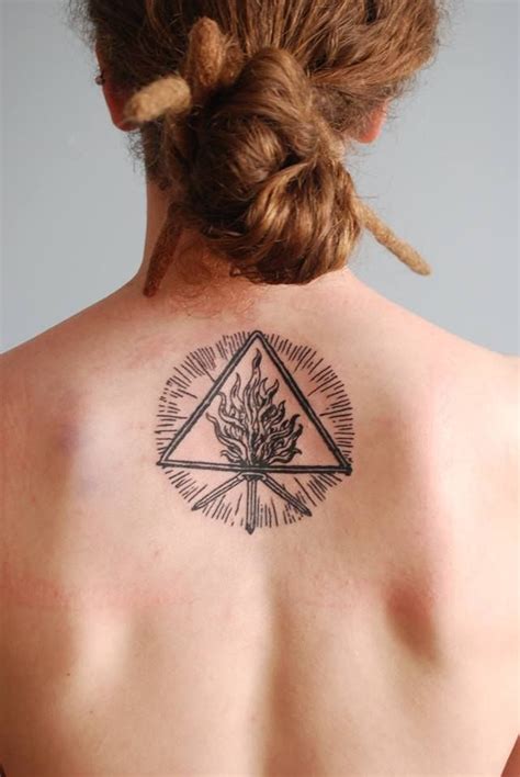 This tattoo includes a black and white inked tattoo of the virgin mary carrying baby jesus in her arms. The Unholy Trinity tattoo | Trinity tattoo, Tattoos ...