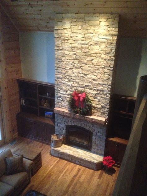 I took a ridiculous amount of photos so bear with me. Cathedral ceiling , stone fireplace, custom barn beam ...
