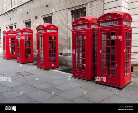Row Of Traditional Red Telephone Boxes In London England Stock Photo
