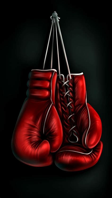 Two Red Boxing Gloves Hanging From Strings