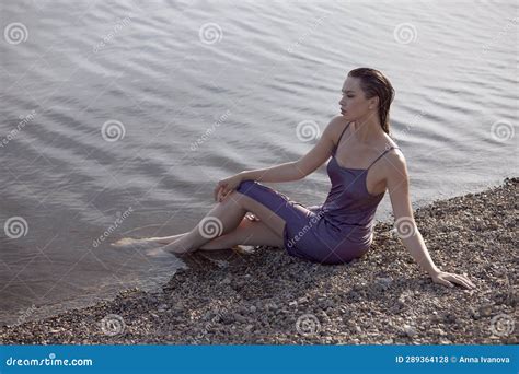 Beautiful Woman Meets Sunset Sitting In Lake Perfect Body Wet Hair