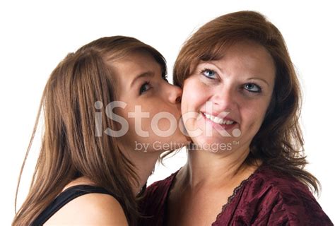 Daughter Kissing Her Mother On White Background Stock Photo Royalty