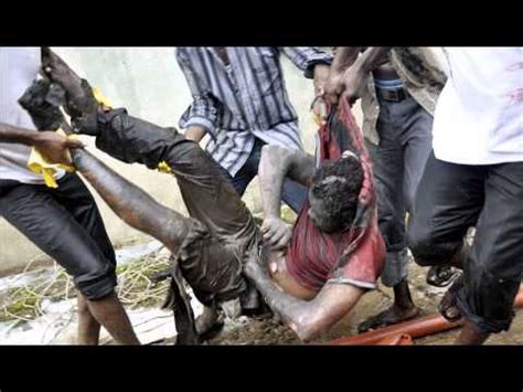 Nigerian army chief 'dies' in plane crash. Devastating: A victim is carried from the scene of plane ...