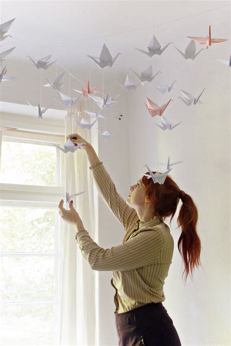 You may think of decoration as just the tables, the walls, and the floor. DIY | Renters-Friendly Origami Ceiling Decoration