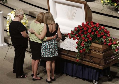 Mourners View The Open Casket Containing The Remains Of Jennings