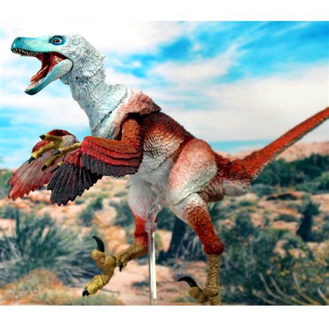 A Toy Dinosaur With Its Mouth Open And Wings Outstretched In The Air