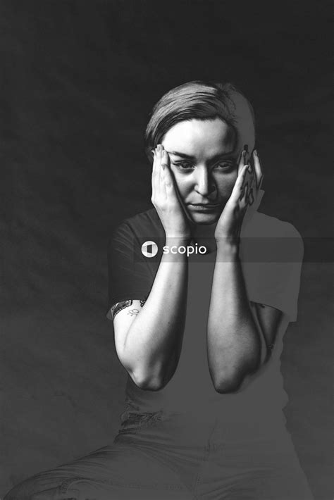 Grayscale Photo Of Woman Covering Her Face