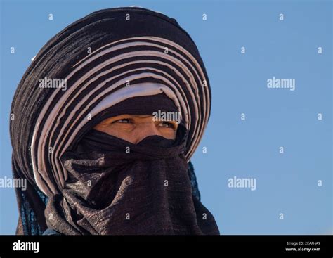 Portrait Of A Tuareg Man In Traditional Clothing Against The Sky