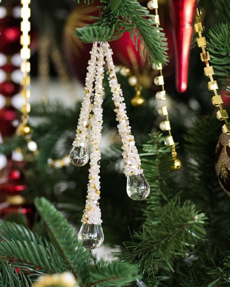Details Of Icy Teardrop Ornaments On A Brilliant Bordeaux Theme Tree