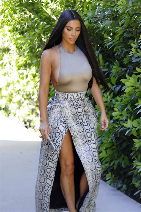 Kim Kardashian Looks Striking In Snakeskin Skirt And Form Fitting Grey