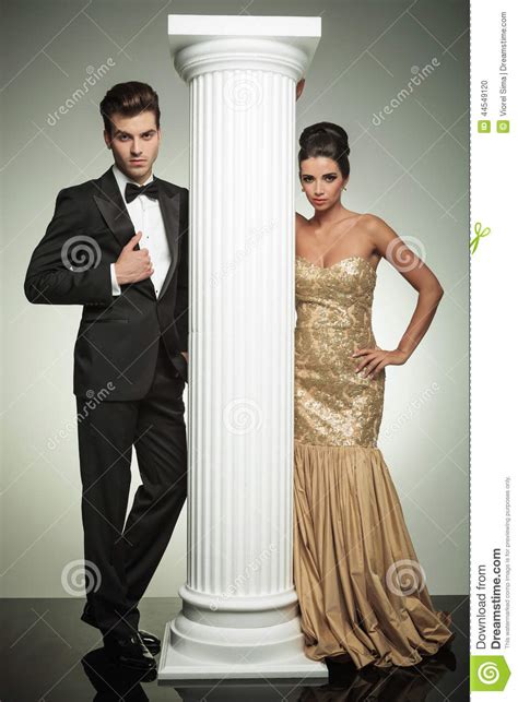 Formal Man And Woman In Evening Clothes Near Column Stock Photo Image