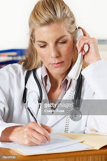 doctors office receptionist on phone photos and premium high res pictures getty images