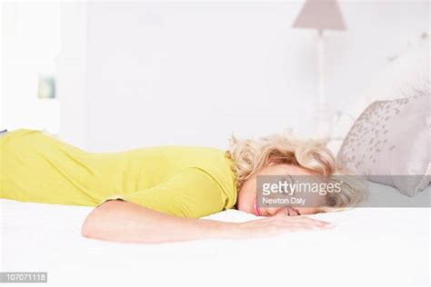 Woman Sprawled Out On Bed Photos And Premium High Res Pictures Getty