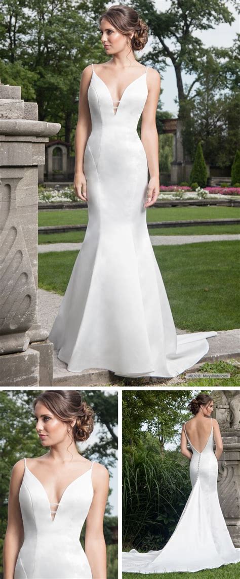 For added drama, the singer wore an unforgettable headpiece embellished with 2,000 austrian crystals. MB2018 Satin mermaid wedding gown features plunging V-neck ...