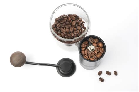 Premium Photo Traditional Coffee Grinder With Coffee Beans