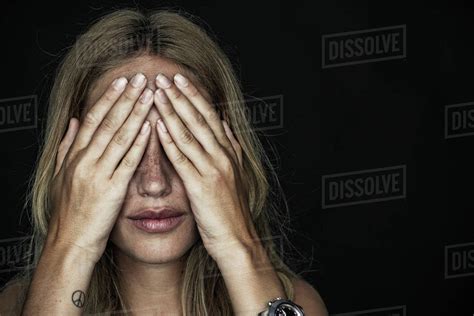 Woman Holding Hands Over Eyes Stock Photo Dissolve