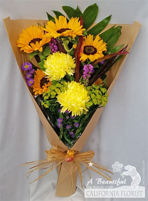 Bouquet of flowers wrapped in paper. Artisan Wrapped Bouquet - Freshest flowers from ABC ...