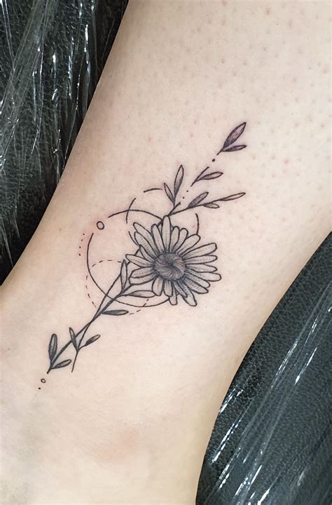 Daisy Tattoo In 2020 Daisy Tattoo Designs Daisy Tattoo Flower Tattoo On Ankle