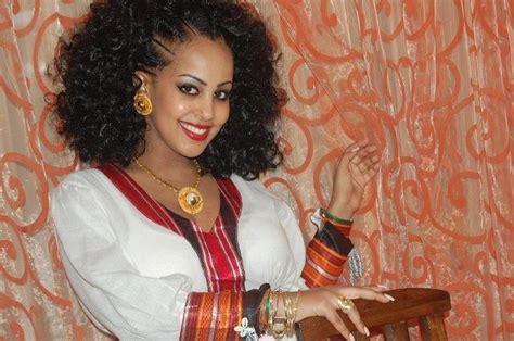 beautiful ethiopian woman with a traditional dress hairstyle and jewelry divine ethiopian