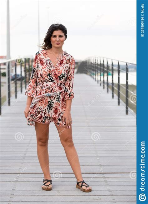 Pretty Woman On Casual Summer Clothing Posing At A Bridge Tourist Girl