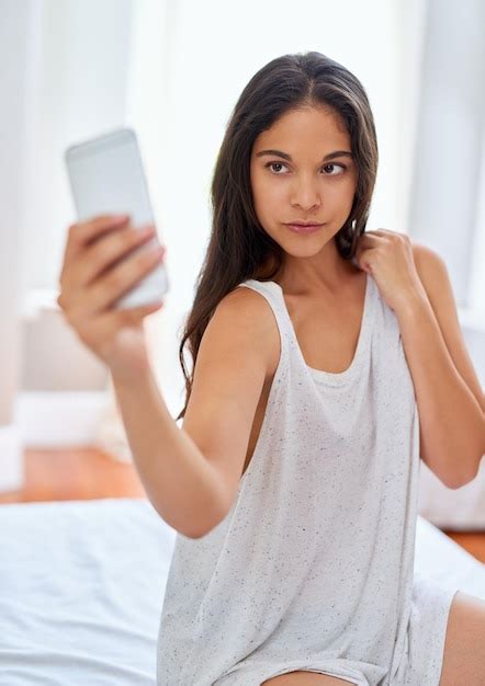 Premium Photo Morning Selfie On Fleek Shot Of A Beautiful Young Woman Taking Selfies On Her