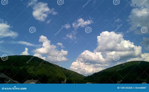 White Cumulus Clouds Over Green Mountains Stock Photo Image Of Blue