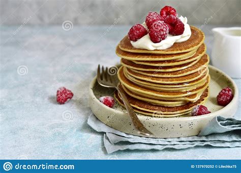 Stack Of Homemade Delicious Hot Pancakes With Honey Cream And