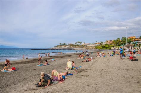 Tenerife Spain Dec 2012 People Sunbathing On The Beach In Resort