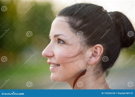 The Girl In Profile Is Smiling Close Up Profile Side Portrait Of A