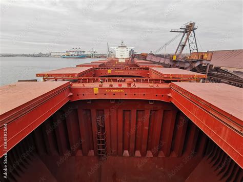 View Of Bulk Carrier Main Deck With Opened Hatch Covers Cargo Holds