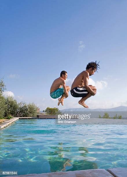 Man Jumping In Swimming Pool Photos And Premium High Res Pictures