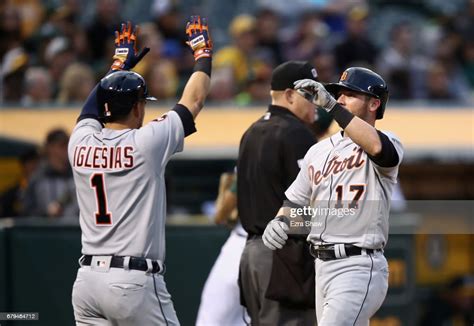 Andrew Romine Of The Detroit Tigers Is Congratulated By Jose Iglesias