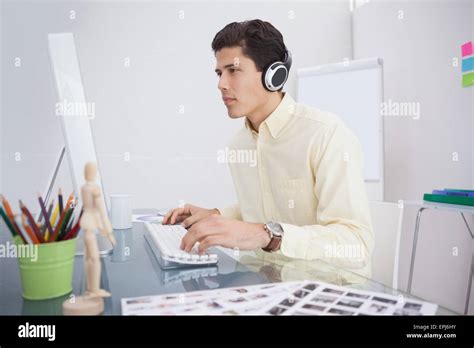 Designer Working And Listening Music Stock Photo Alamy