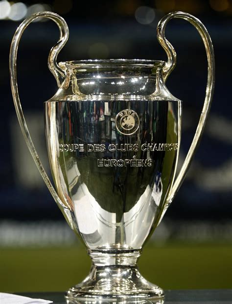 The trophy, a silver cup on a yellow marble plinth, was designed and crafted by the bertoni workshop in milan. UEFA Champions League -- Trophy (european international ...