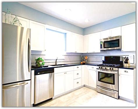 White shaker kitchen cabinets have become a favorite among homeowners since long because of the attractive look. White Kitchen Cabinets Stainless Steel Appliances | Kitchen cabinet design, Kitchen cabinets