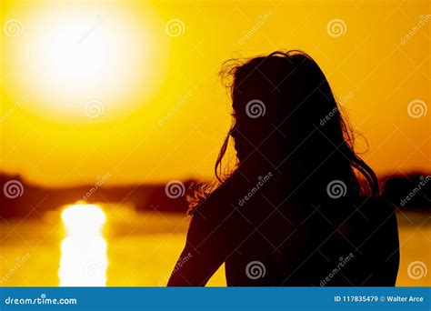 Hispanic Brunette Model Enjoying An Early Morning Sunrise Stock Image