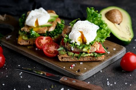 Delicious Sandwich With Avocado And Poached Egg Stock Photo Image Of