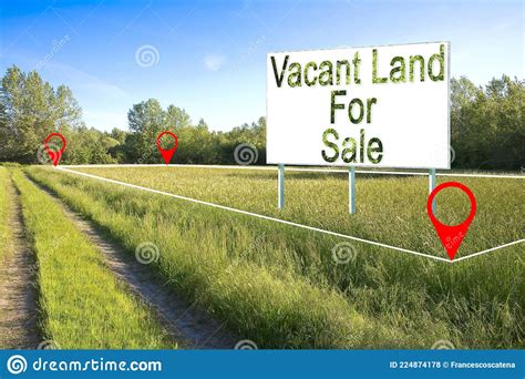 Advertising Billboard In A Rural Scene With Vacant Land For Sale
