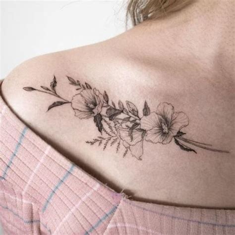 Red and black are the two most popular colours of tattoo. Collarbone Tattoos: 100 Designs that Look Great on Both ...